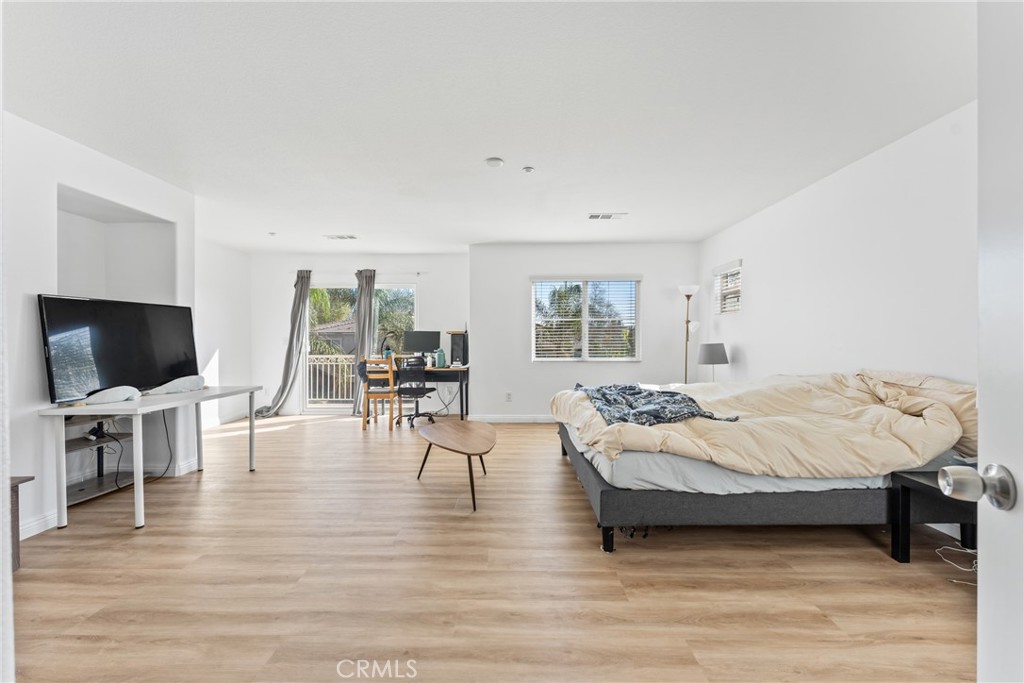 4816 Gregory Road Riverside, CA 92501 - Photo 34 of 55 a bedroom with furniture and a flat screen tv