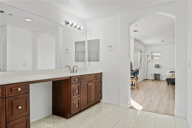 a front view of a house with garden and patio