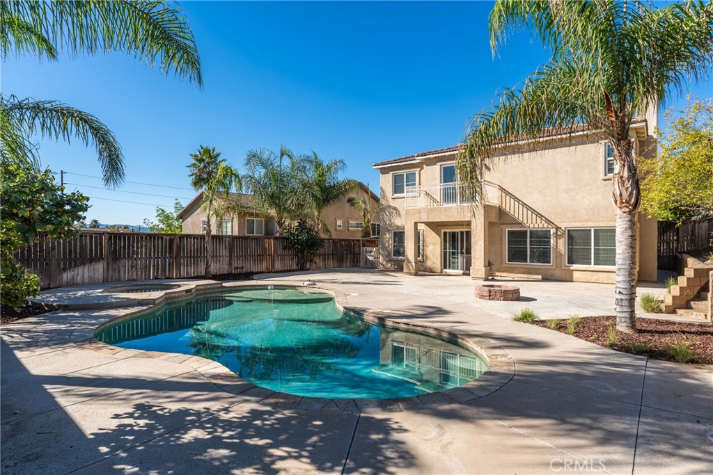 4816 Gregory Road Riverside, CA 92501 - Photo 41 of 55 a front view of a house with garden and patio