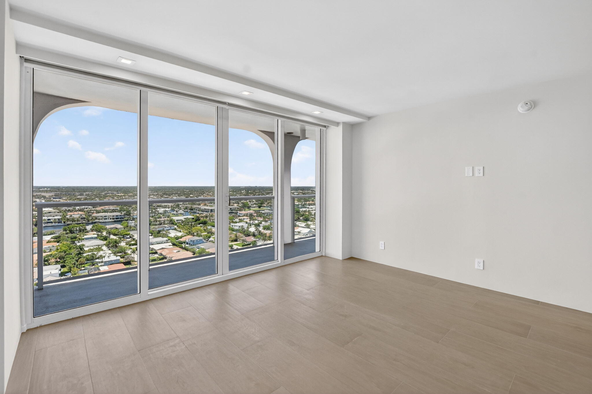 2800 South Ocean Boulevard, Unit 23C Boca Raton, FL 33432 - Photo 37 of 50 wooden floor in an empty room with a window