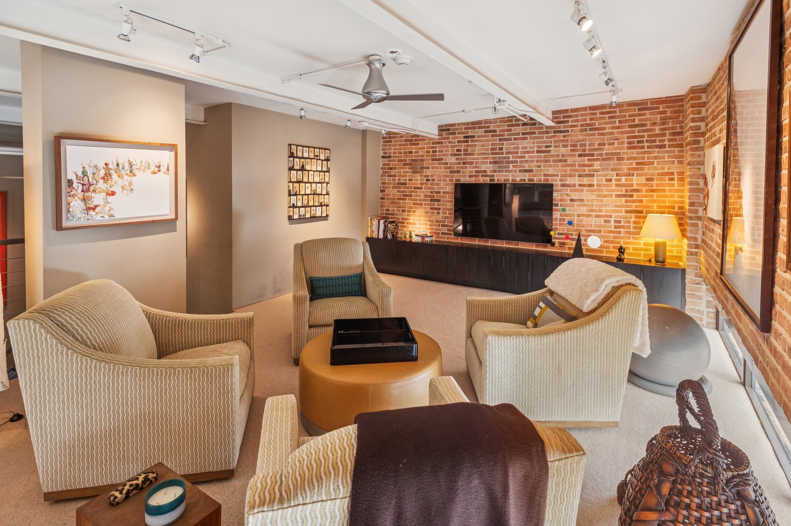 23 North Green Street, Unit 504 Chicago, IL 60607 - Photo 14 of 30 a living room with furniture a flat screen tv and a fireplace