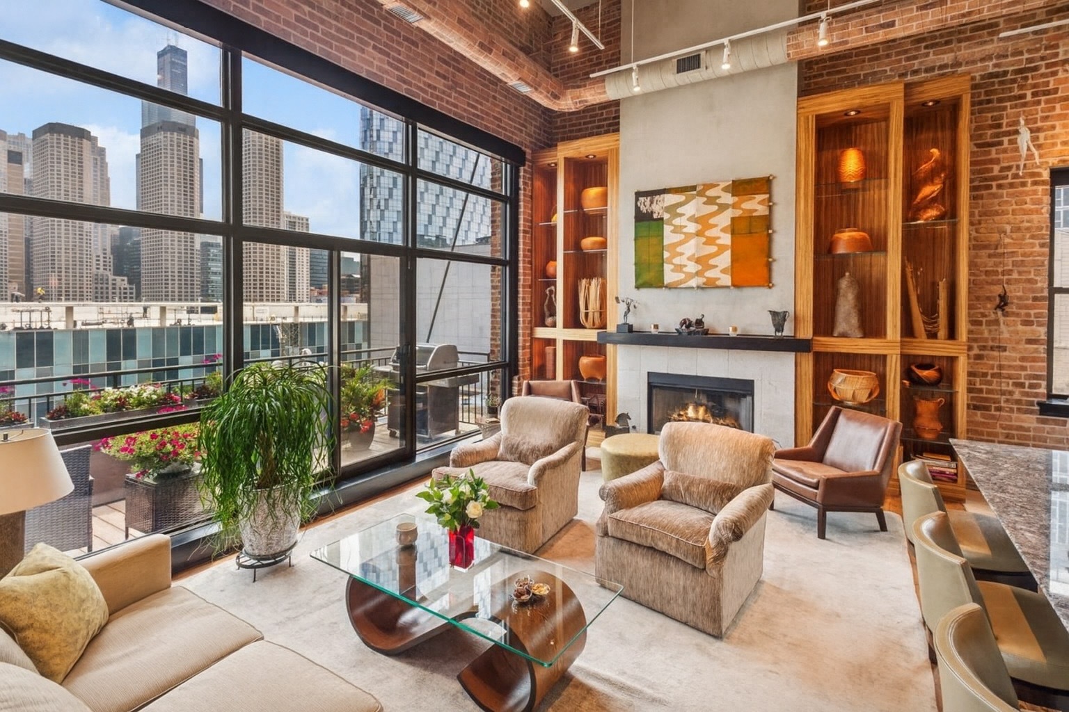 23 North Green Street, Unit 504 Chicago, IL 60607 - Photo 3 of 30 a living room with furniture a fireplace and floor to ceiling windows