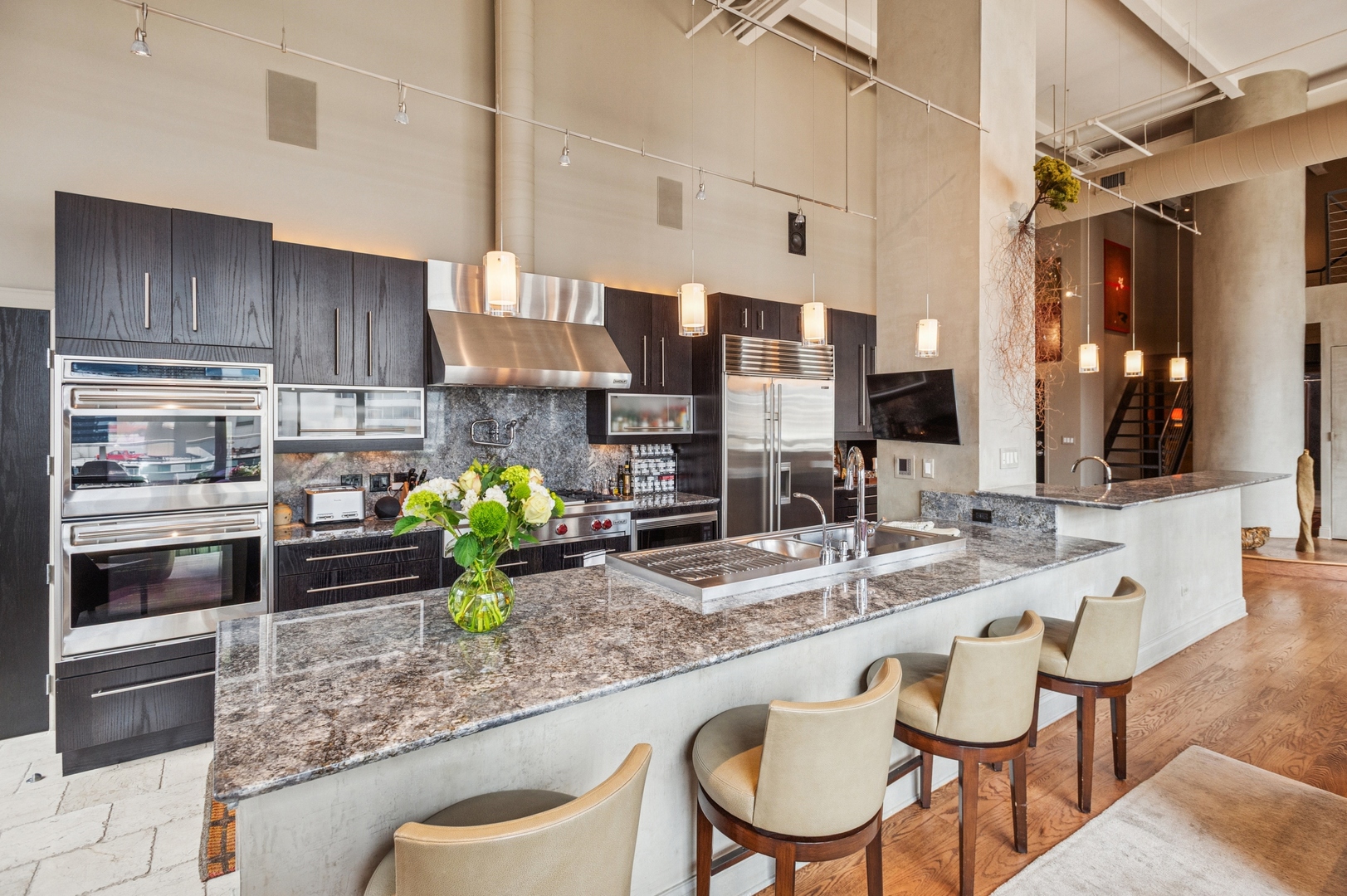 23 North Green Street, Unit 504 Chicago, IL 60607 - Photo 4 of 30 a kitchen with a table and chairs in it
