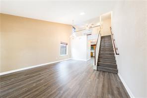 805 Chiselpoint Cove Round Rock, TX 78681 - Photo 17 of 38 Unfurnished living room with dark wood finished floors