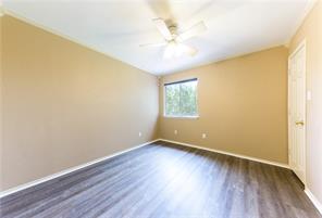 805 Chiselpoint Cove Round Rock, TX 78681 - Photo 22 of 38 Spare room featuring dark wood-type flooring and a ceiling fan