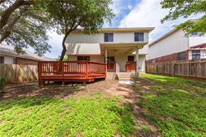 805 Chiselpoint Cove Round Rock, TX 78681 - Photo 33 of 38 Back of house with a fenced backyard, stucco siding, and a deck