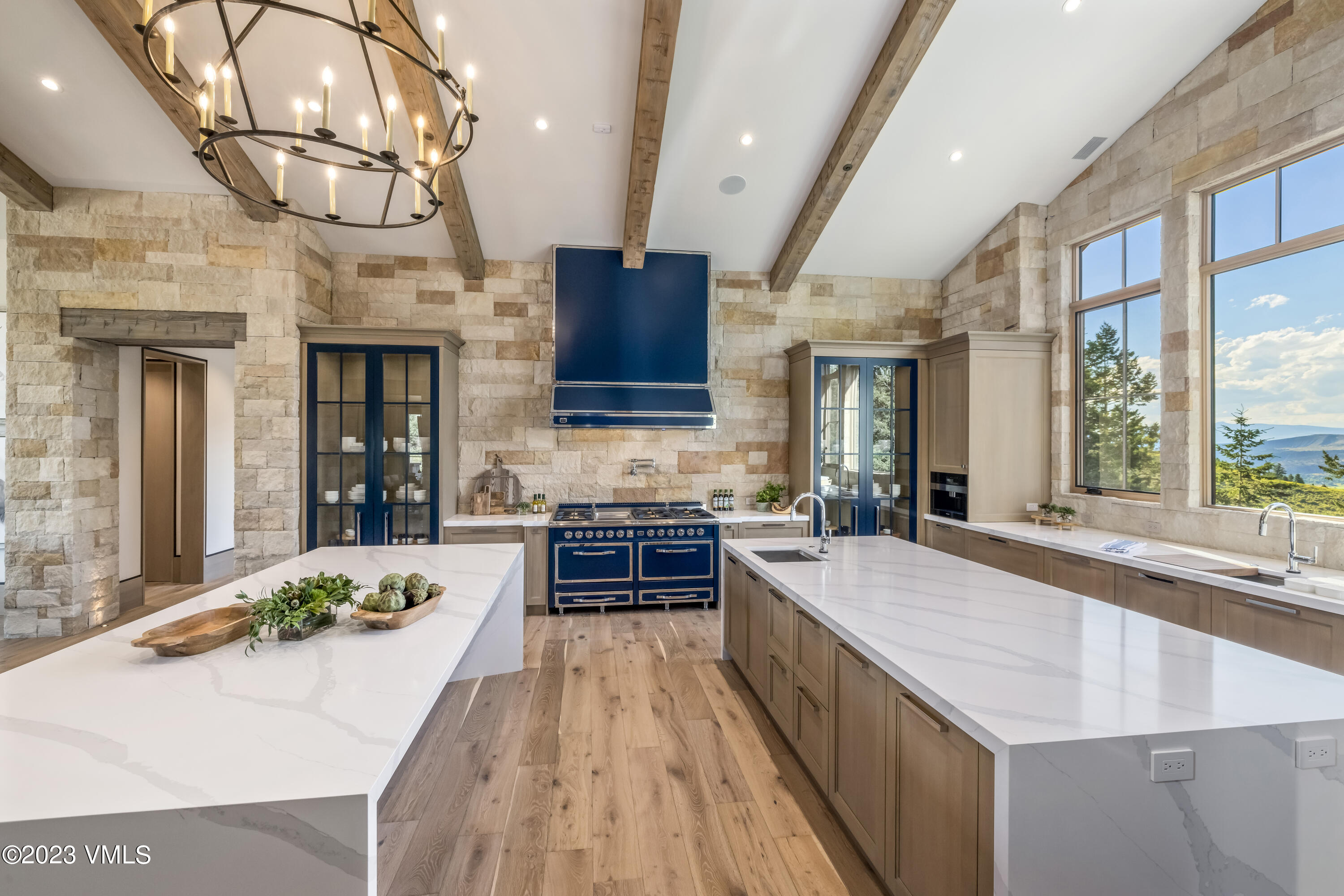 335 Elkhorn Avon, CO 81620 - Photo 11 of 73 a large kitchen with stainless steel appliances granite countertop plenty wooden cabinets counter space and a window
