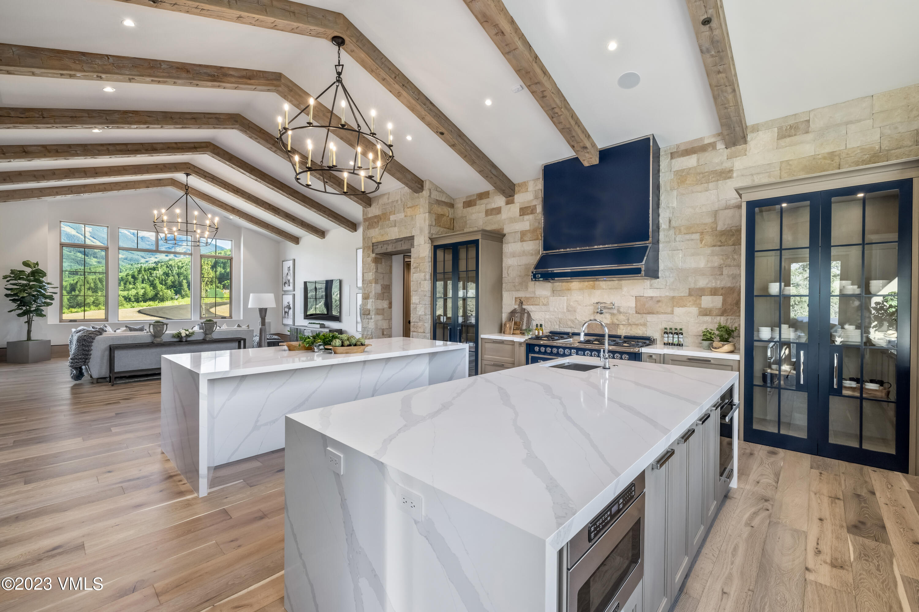 335 Elkhorn Avon, CO 81620 - Photo 17 of 73 a large kitchen with kitchen island a large island in it