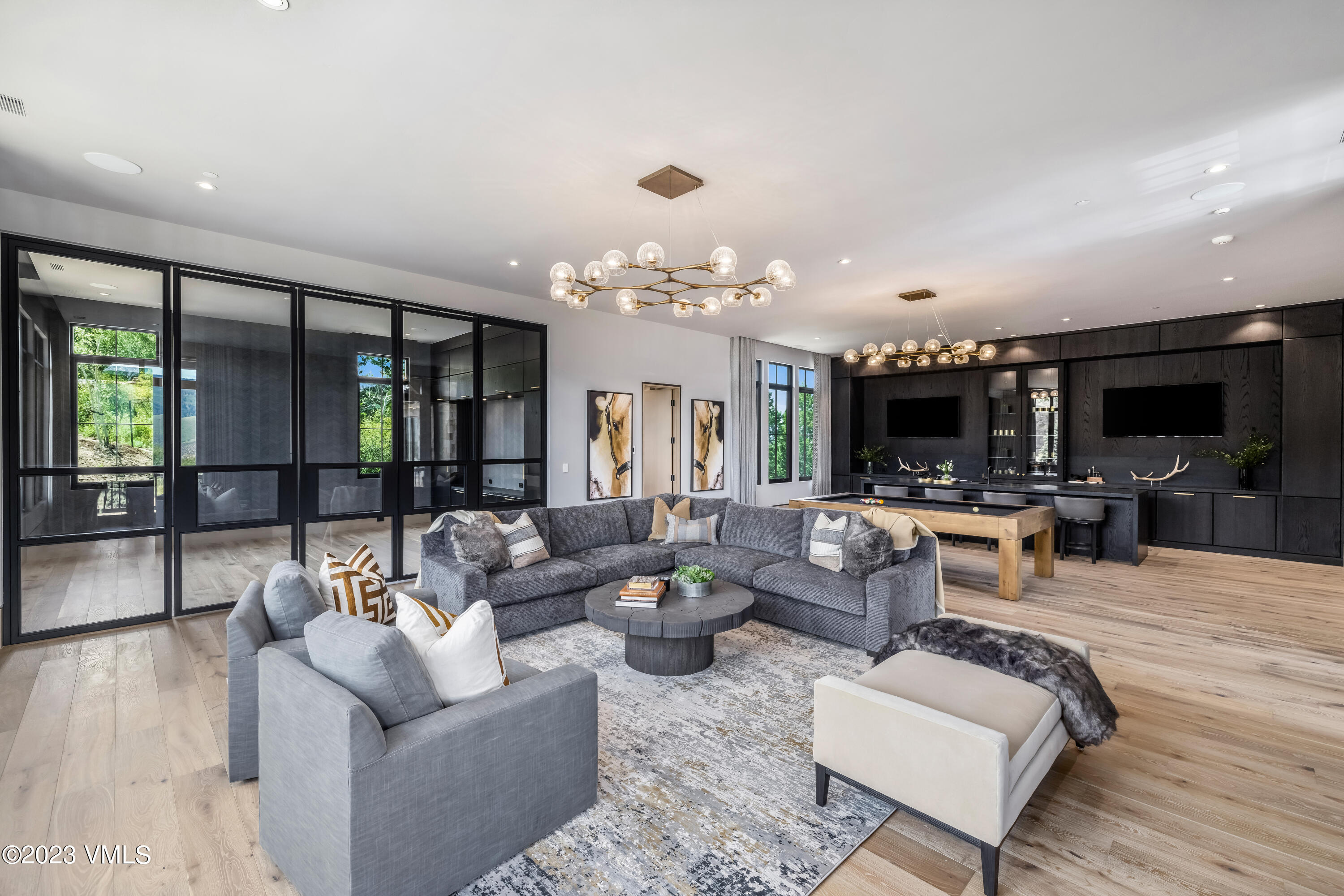 335 Elkhorn Avon, CO 81620 - Photo 36 of 73 a living room with furniture and a chandelier