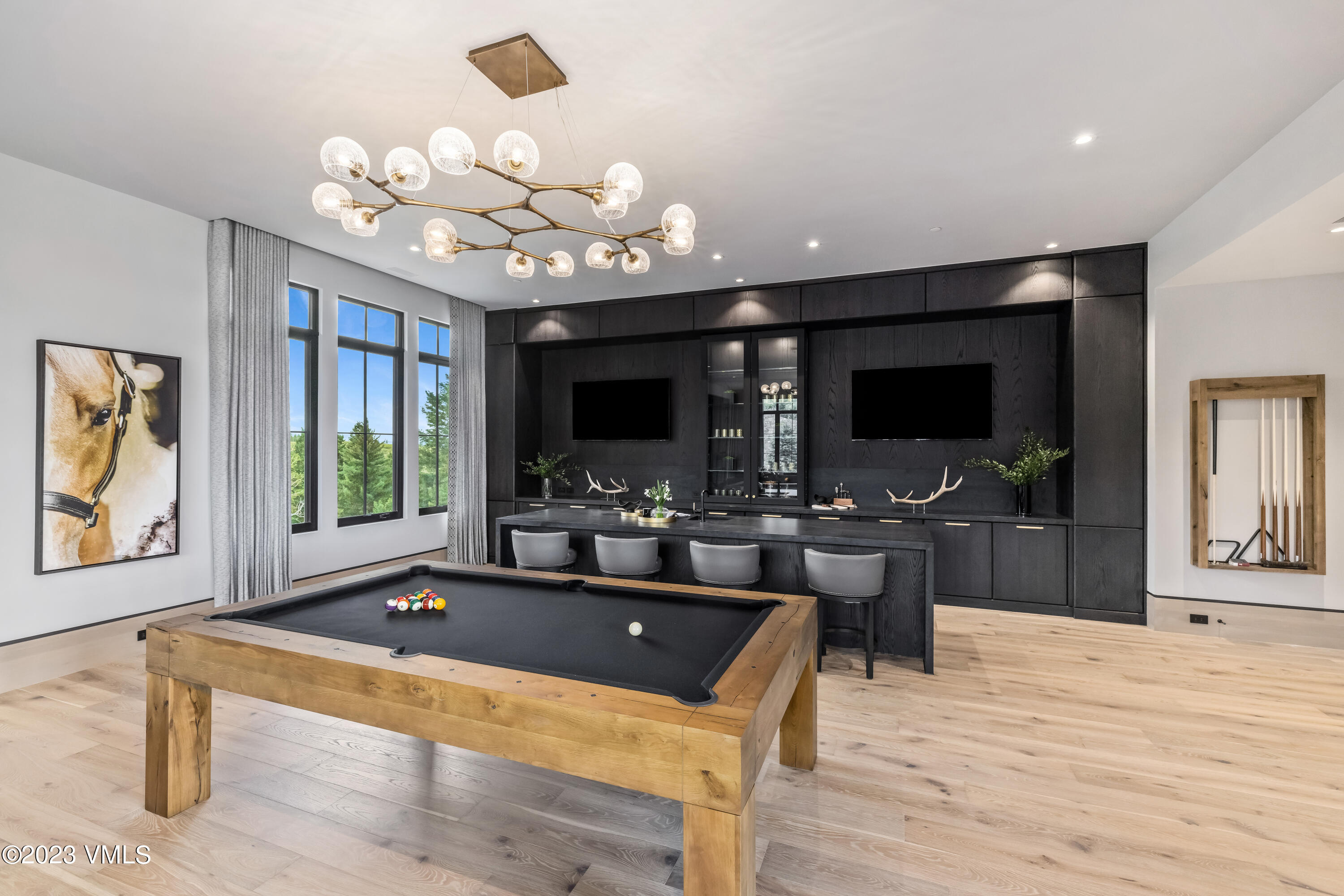 335 Elkhorn Avon, CO 81620 - Photo 39 of 73 a view of a dining room with furniture a chandelier and wooden floor
