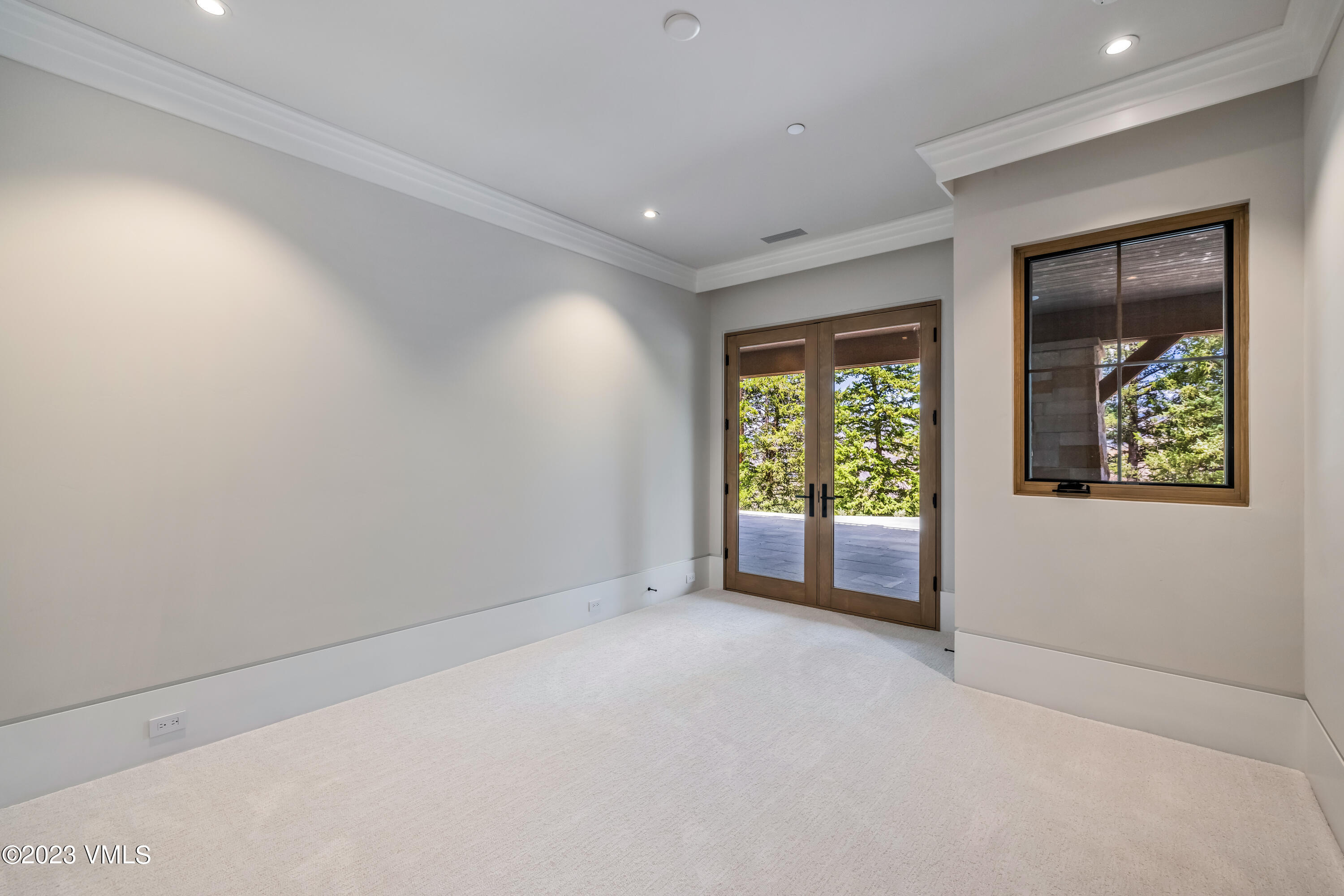 335 Elkhorn Avon, CO 81620 - Photo 55 of 73 a view of a big room with windows and chandelier
