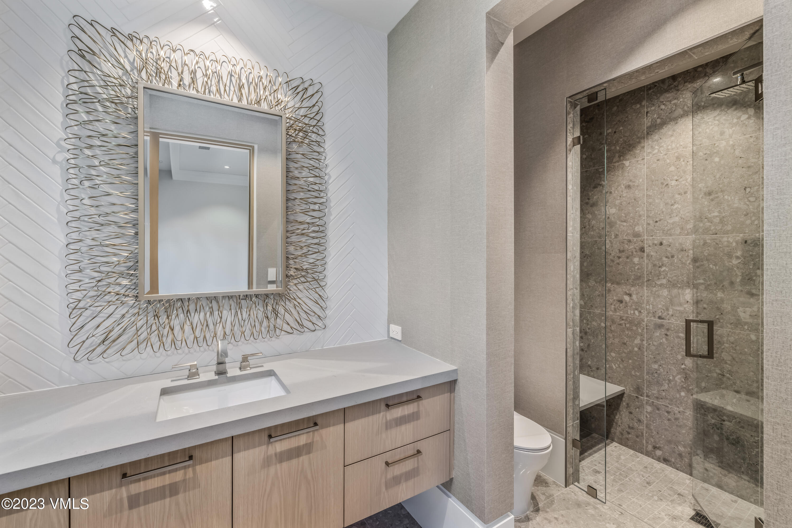 335 Elkhorn Avon, CO 81620 - Photo 64 of 73 a bathroom with a granite countertop sink a toilet and a shower