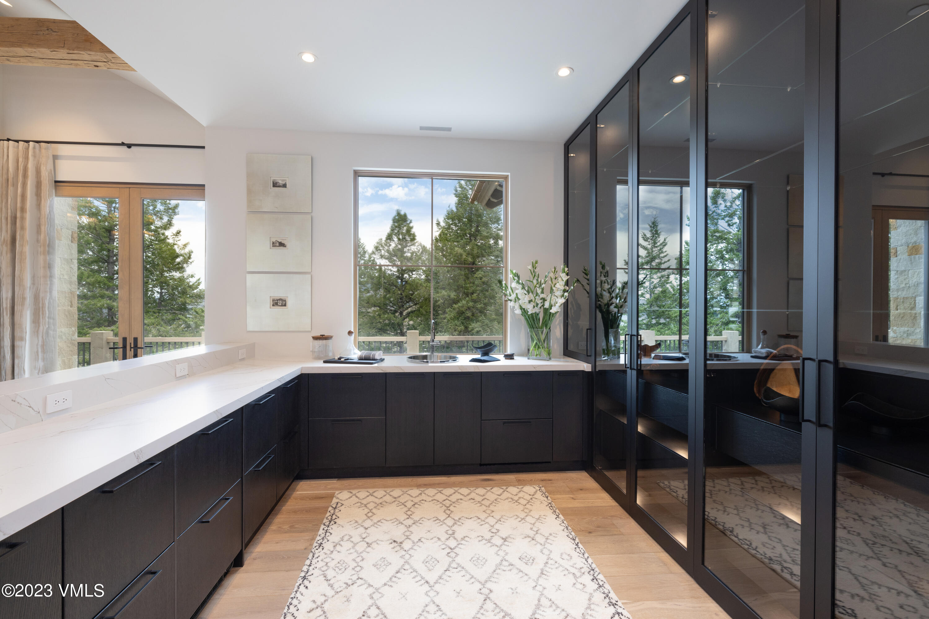 335 Elkhorn Avon, CO 81620 - Photo 8 of 73 a large kitchen with kitchen island granite countertop a large window and a counter space