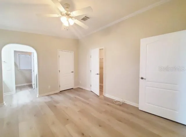 a white toilet sitting next to a shower