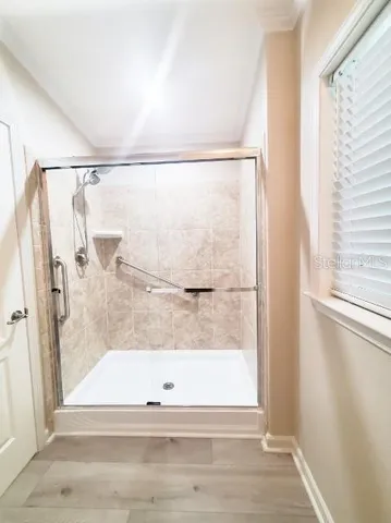 a bathroom with a bath tub and a shower