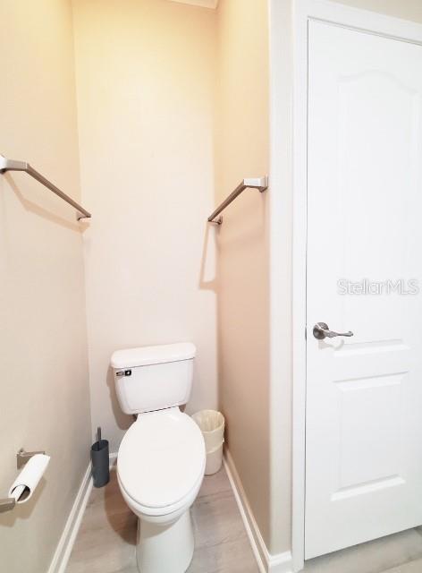 12116 Southwest County 769 Rd Lake, Unit 121 Lake Suzy, FL 34269 - Photo 19 of 45 a white toilet sitting next to a shower