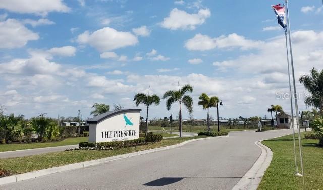 12116 Southwest County 769 Rd Lake, Unit 121 Lake Suzy, FL 34269 - Photo 2 of 45 a view of a street with cars parked