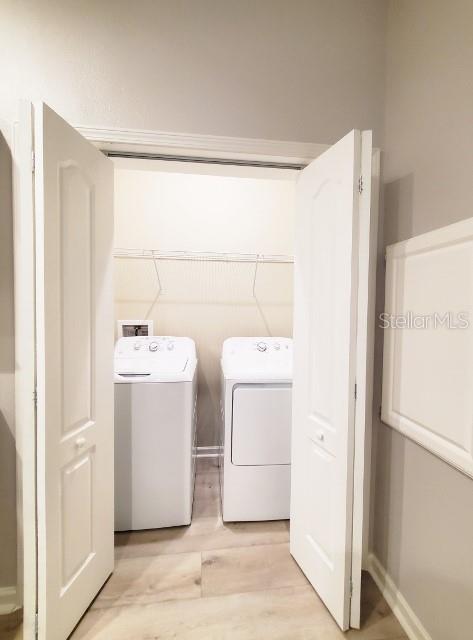 12116 Southwest County 769 Rd Lake, Unit 121 Lake Suzy, FL 34269 - Photo 26 of 45 a utility room with dryer and washer