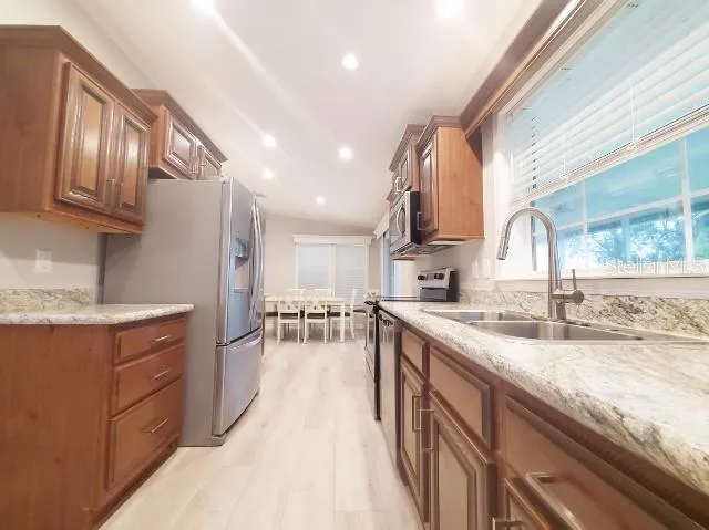 a refrigerator freezer sitting in a kitchen