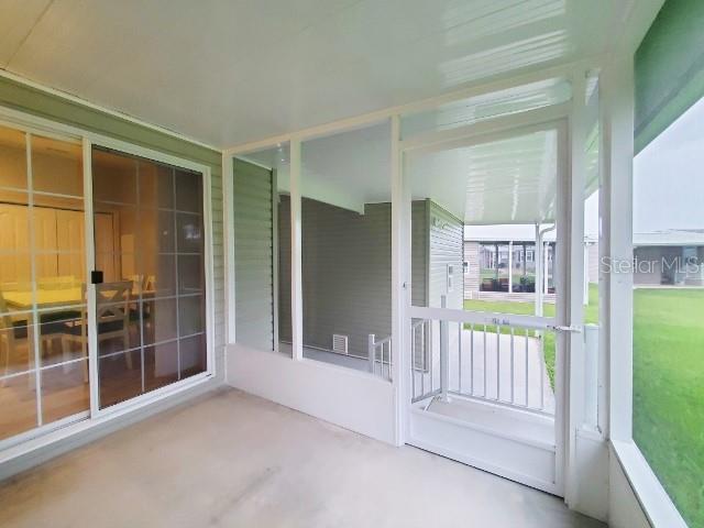 12116 Southwest County 769 Rd Lake, Unit 121 Lake Suzy, FL 34269 - Photo 38 of 45 a view of front door and porch
