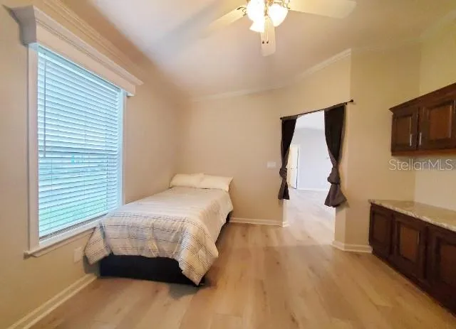 a view of an empty room with kitchen
