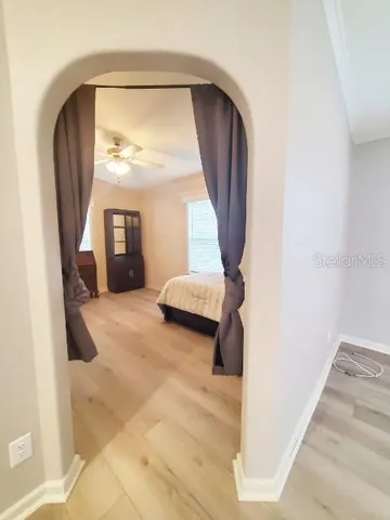 a bathroom with a granite countertop sink toilet a mirror and shower
