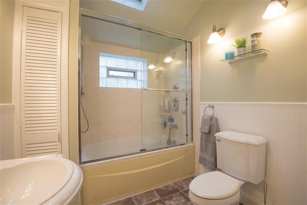 Owners spared no expense in this renovated bath with skylight, ceramic tile, and large jet tub.  This feels like a spa right at home!