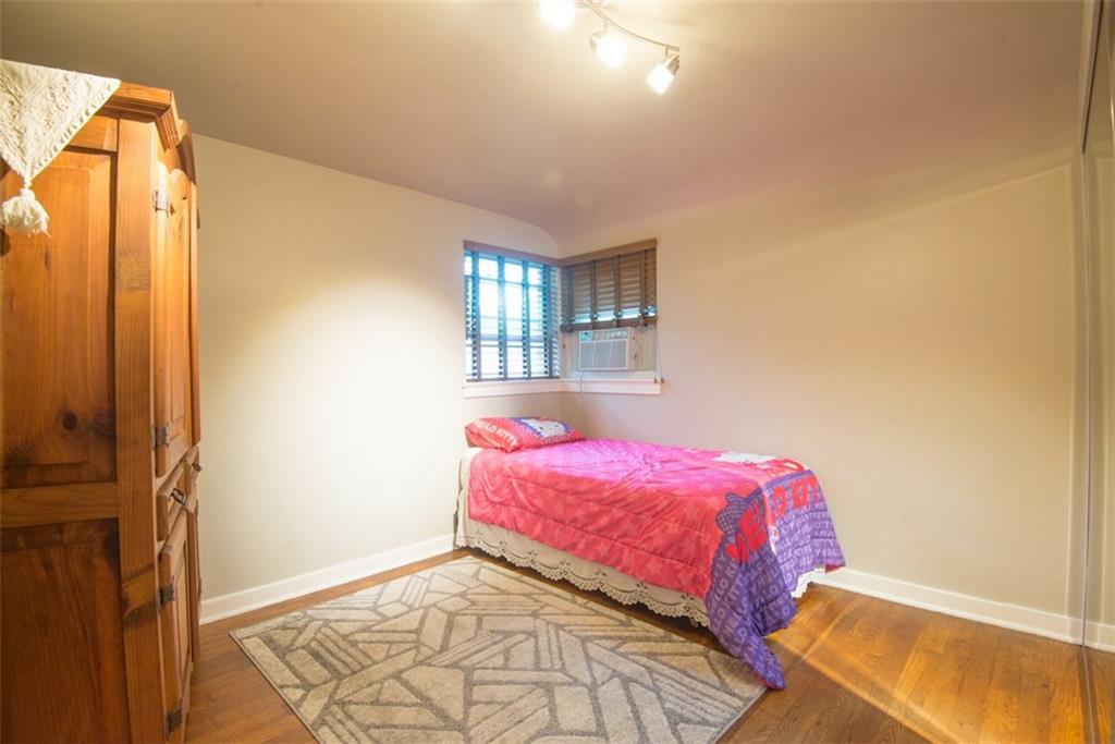 2919 Laketon Road Pittsburgh, PA 15235 - Photo 10 of 19 11x10 second bedroom with hardwood floors and track lighting. Large closet not pictured.