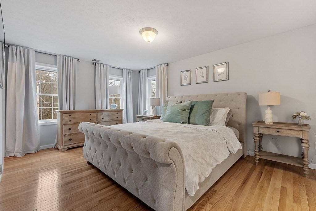 41 Willard Road Ashburnham, MA 01430 - Photo 19 of 42 a large bedroom with a bed and a large window