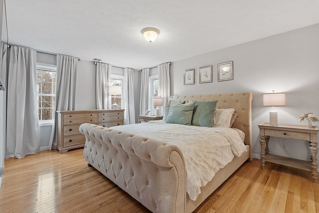 41 Willard Road Ashburnham, MA 01430 - Photo 20 of 42 a large bedroom with a bed and a large window