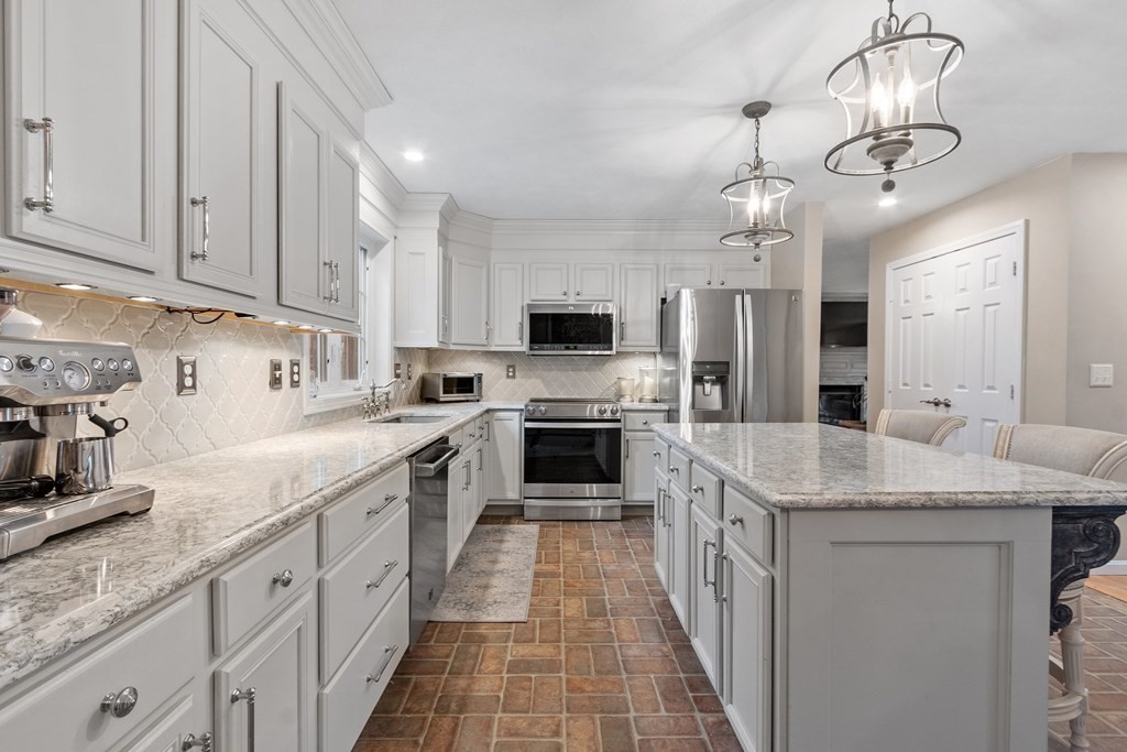 41 Willard Road Ashburnham, MA 01430 - Photo 2 of 42 a kitchen with stainless steel appliances granite countertop a sink and dishwasher a stove with wooden floor