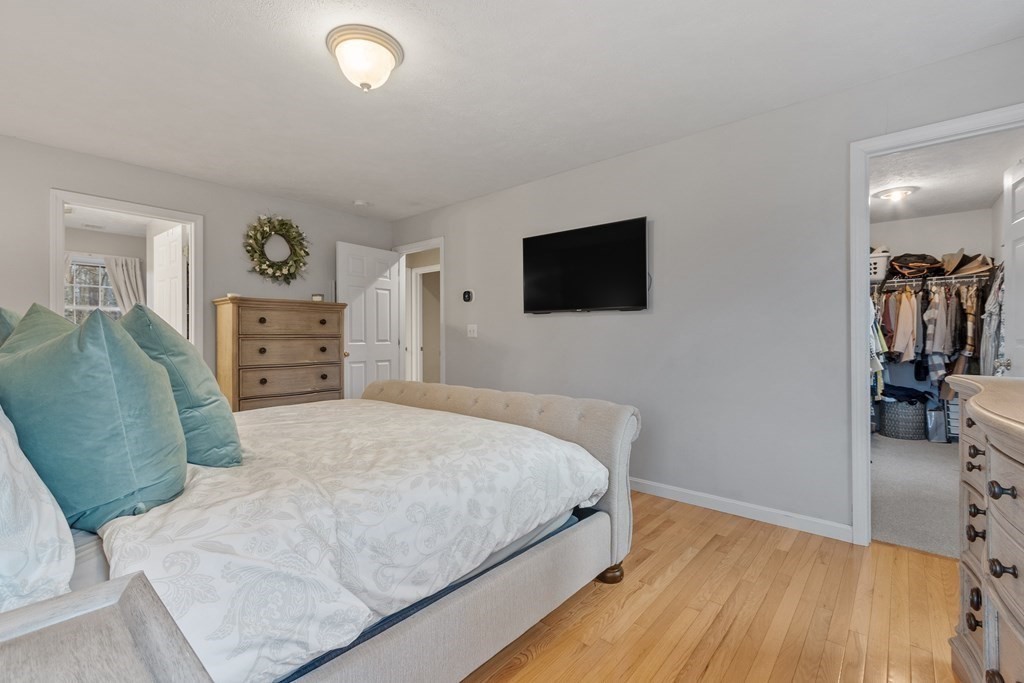 41 Willard Road Ashburnham, MA 01430 - Photo 21 of 42 a bedroom with a bed and a flat screen tv