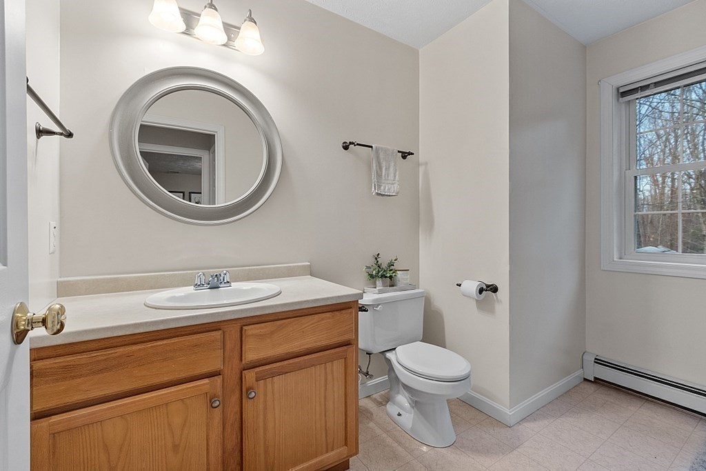 41 Willard Road Ashburnham, MA 01430 - Photo 28 of 42 a bathroom with a toilet a sink and a mirror