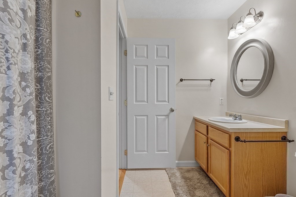 41 Willard Road Ashburnham, MA 01430 - Photo 29 of 42 a bathroom with a sink a vanity and a mirror