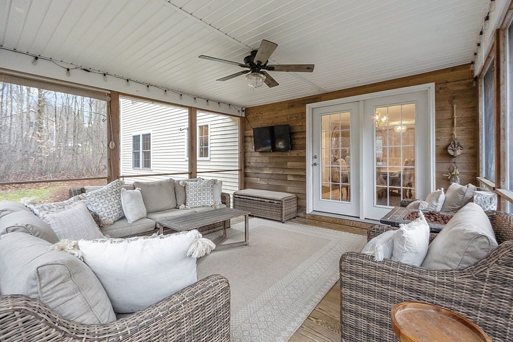 41 Willard Road Ashburnham, MA 01430 - Photo 34 of 42 a living room with furniture ceiling fan and a large window
