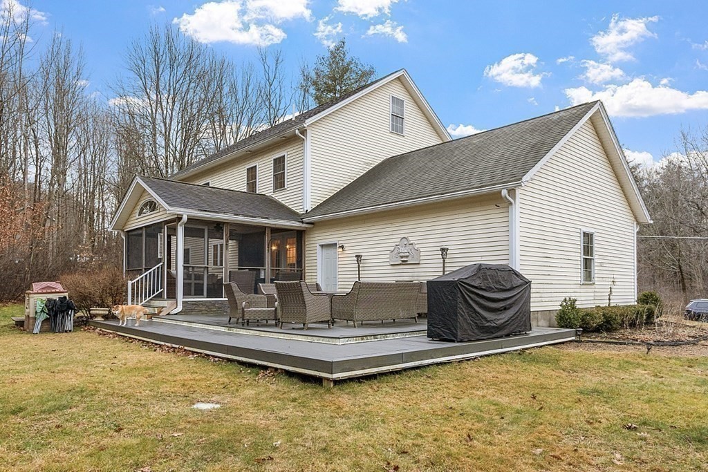41 Willard Road Ashburnham, MA 01430 - Photo 38 of 42 a front view of house with yard outdoor seating and barbeque oven