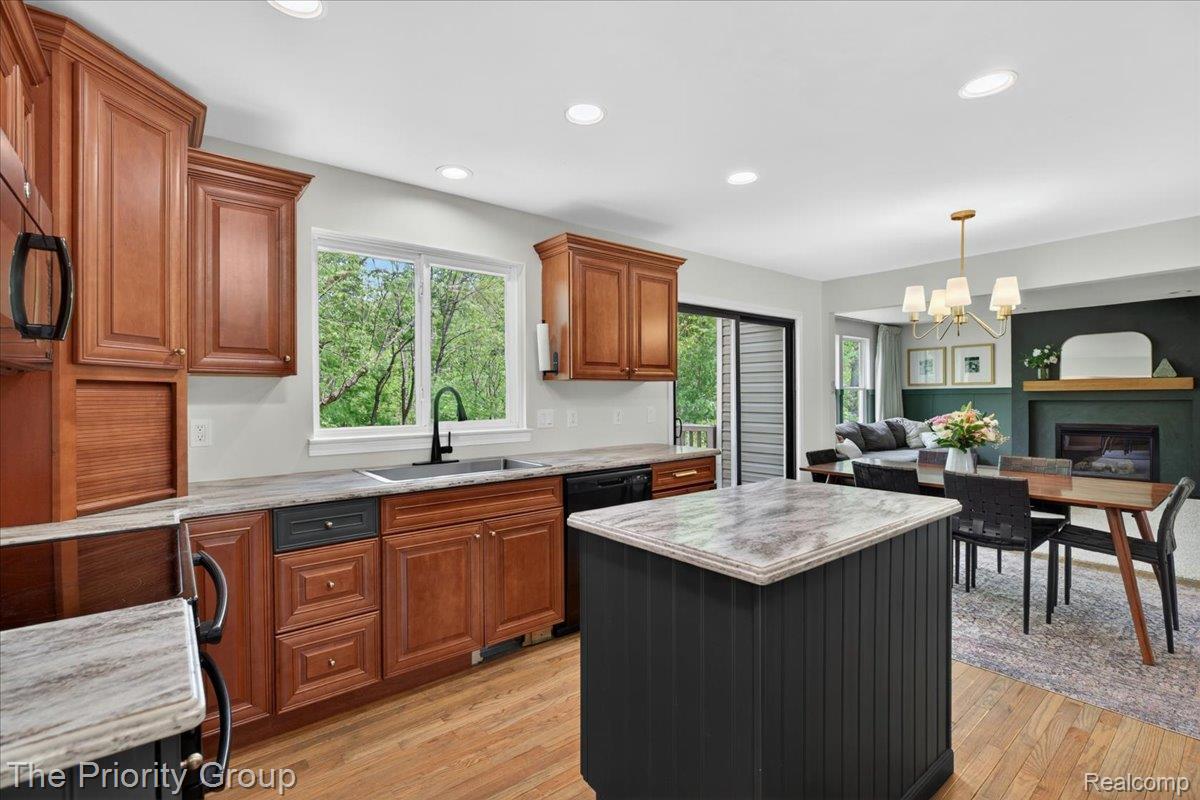 517 Deer Valley Road Holly, MI 48442 - Photo 11 of 61 Kitchen featuring a kitchen island, plenty of natural light and dual tone cabinets