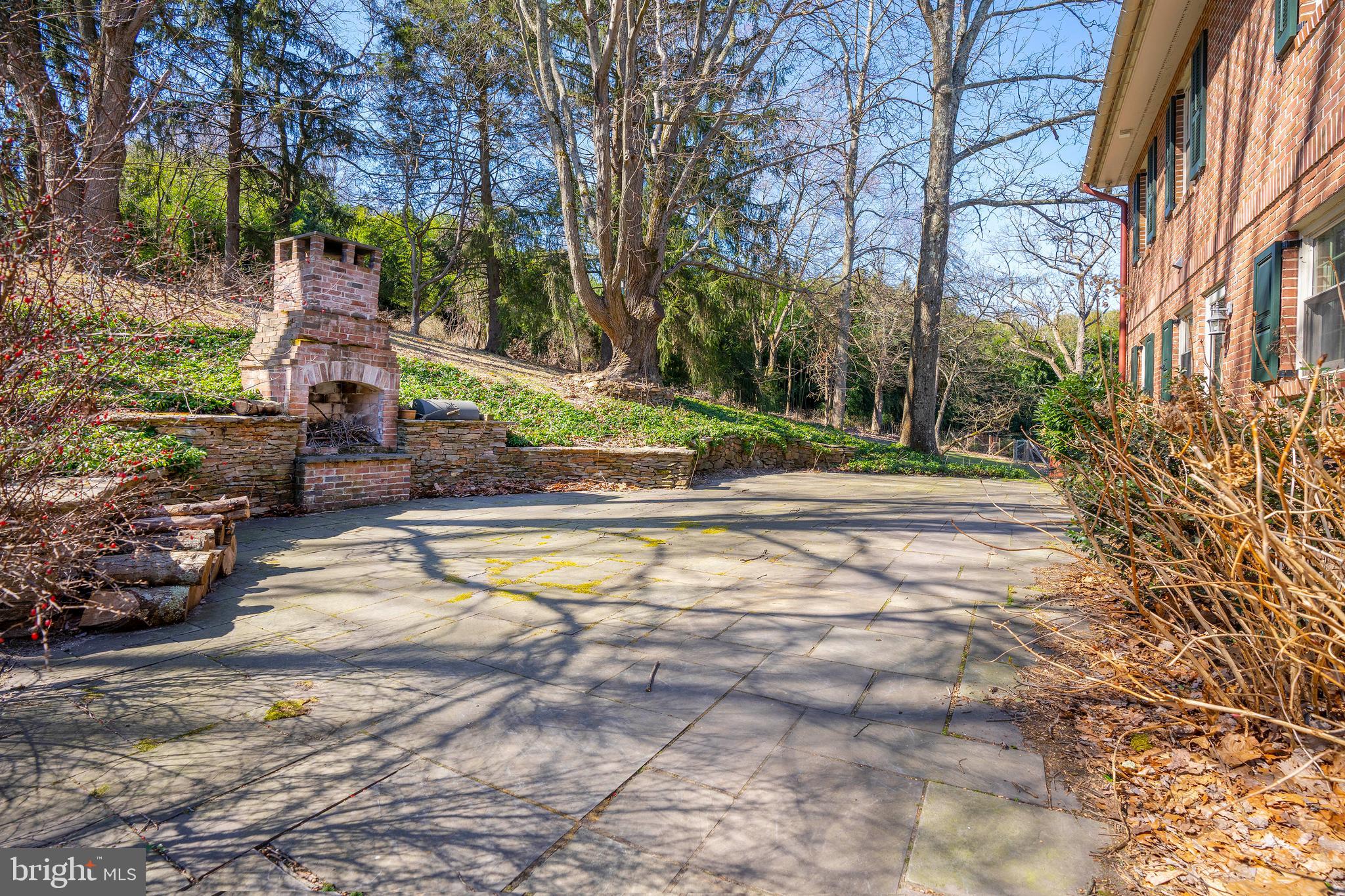358 Ring Road Chadds Ford, PA 19317 - Photo 54 of 78 Patio with custom stone wall and fireplace