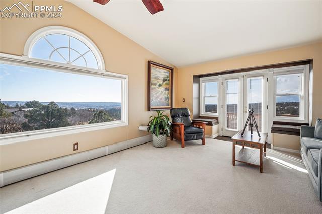 8475 Red Spring Valley Road Colorado Springs, CO 80919 - Photo 13 of 50 Large upper level bedroom with walk out to a deck and stunning views.