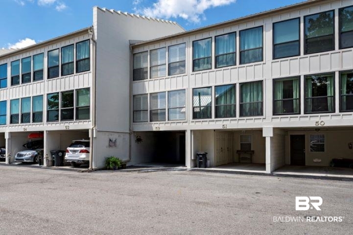 710 South Mobile Street, Unit 52 Fairhope, AL 36532 - Photo 47 of 58 View of building exterior with covered parking