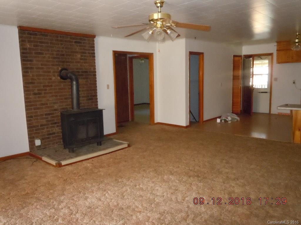 61 Stroupe Road Canton, NC 28716 - Photo 6 of 10 en empty room with windows and ceiling fan