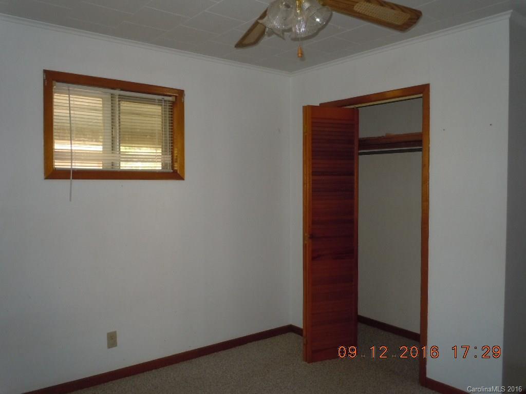 61 Stroupe Road Canton, NC 28716 - Photo 7 of 10 an empty room with a window