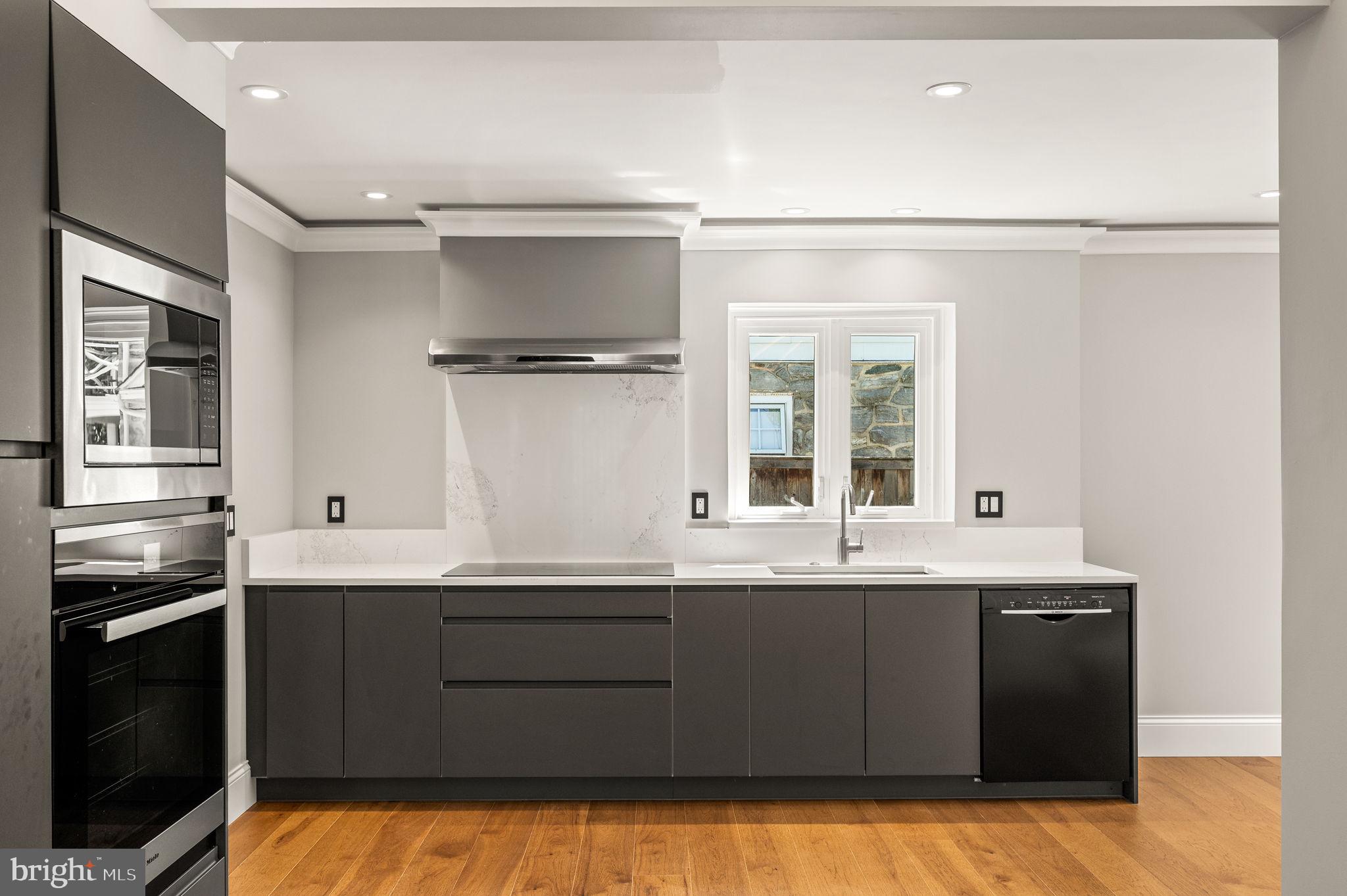 547 West Beechtree Lane Wayne, PA 19087 - Photo 13 of 51 a kitchen with a sink and cabinets