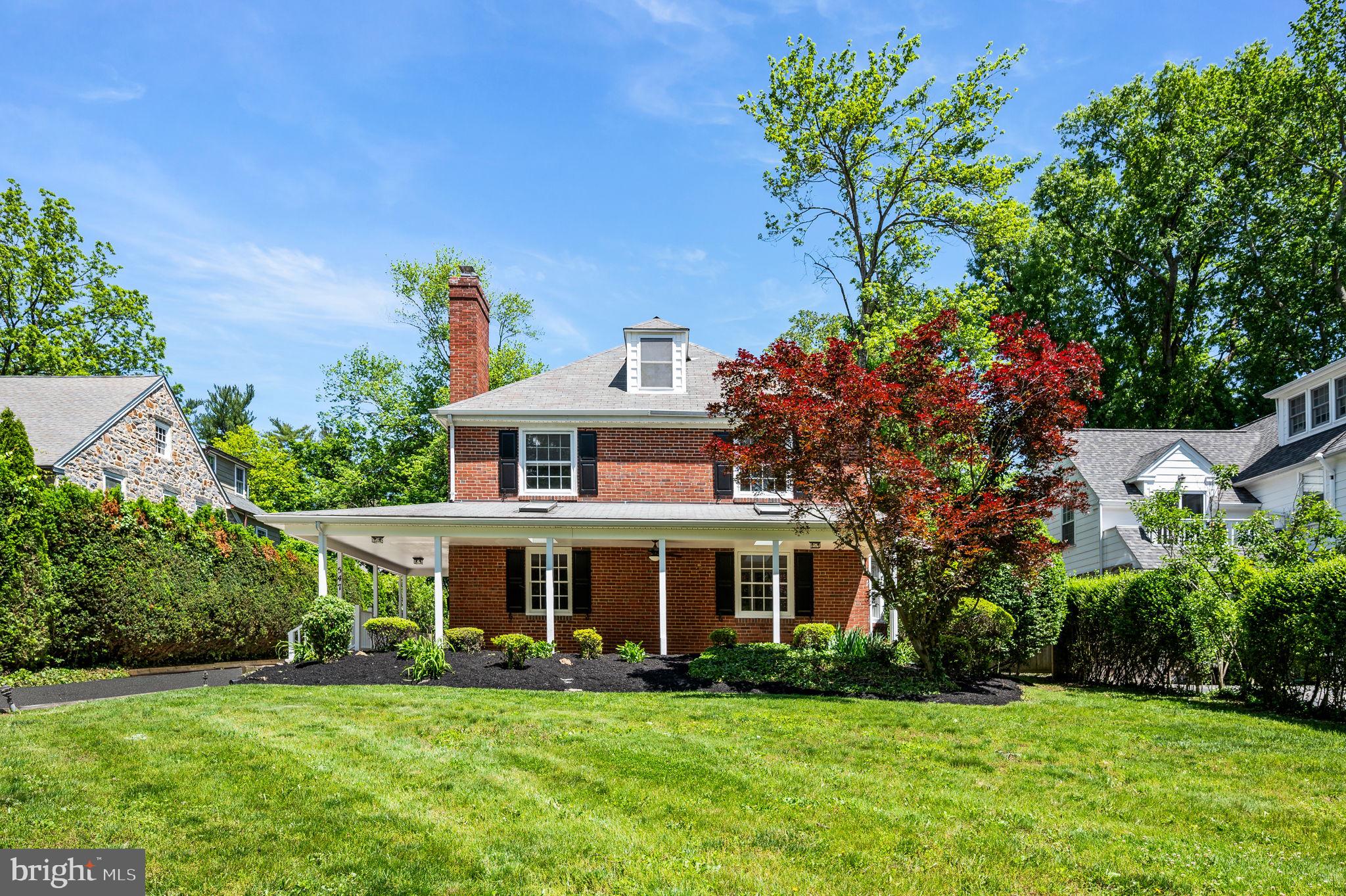 547 West Beechtree Lane Wayne, PA 19087 - Photo 2 of 51 a front view of a house with a garden