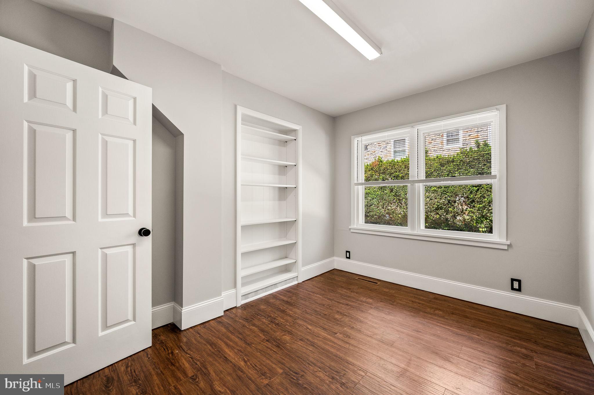 547 West Beechtree Lane Wayne, PA 19087 - Photo 21 of 51 a view of an empty room with wooden floor and window
