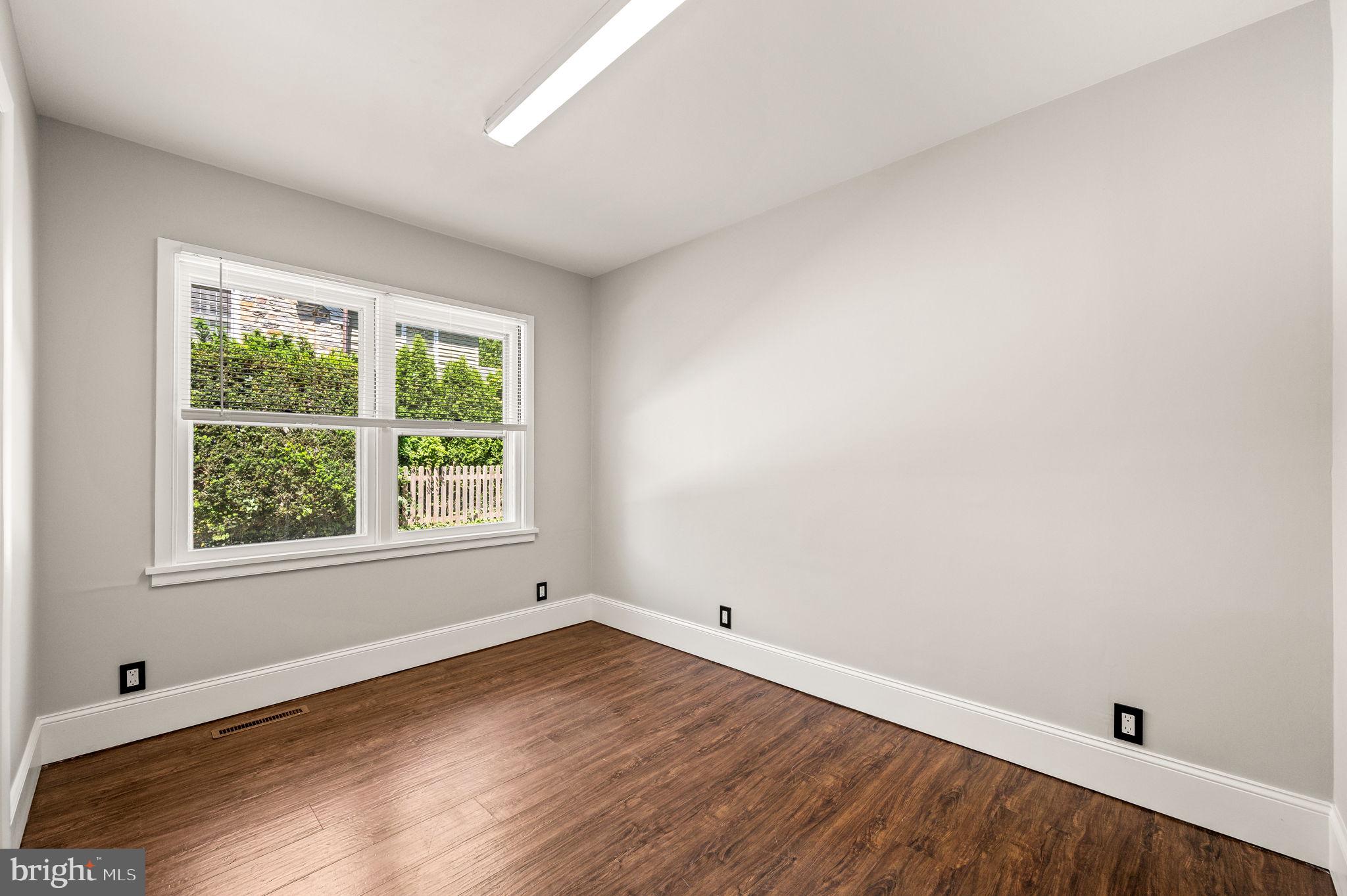 547 West Beechtree Lane Wayne, PA 19087 - Photo 22 of 51 an empty room with wooden floor and windows