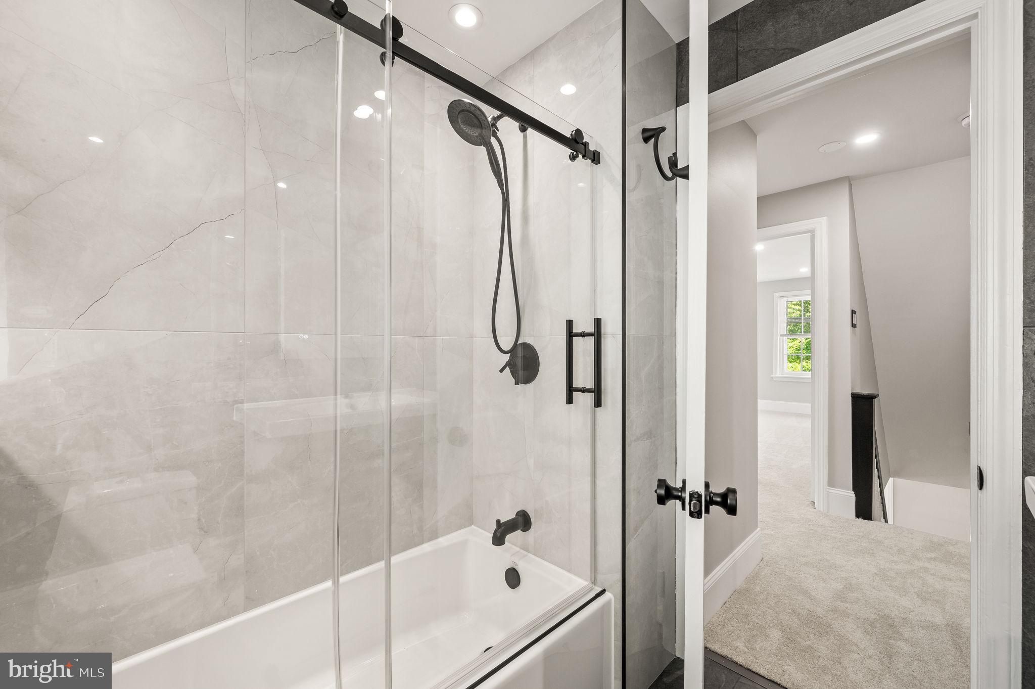 547 West Beechtree Lane Wayne, PA 19087 - Photo 29 of 51 a bathroom with a bathtub and a shower