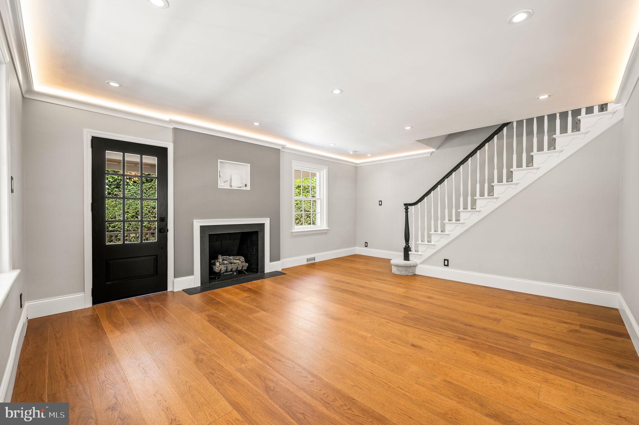 547 West Beechtree Lane Wayne, PA 19087 - Photo 7 of 51 a view of empty room with wooden floor and fireplace