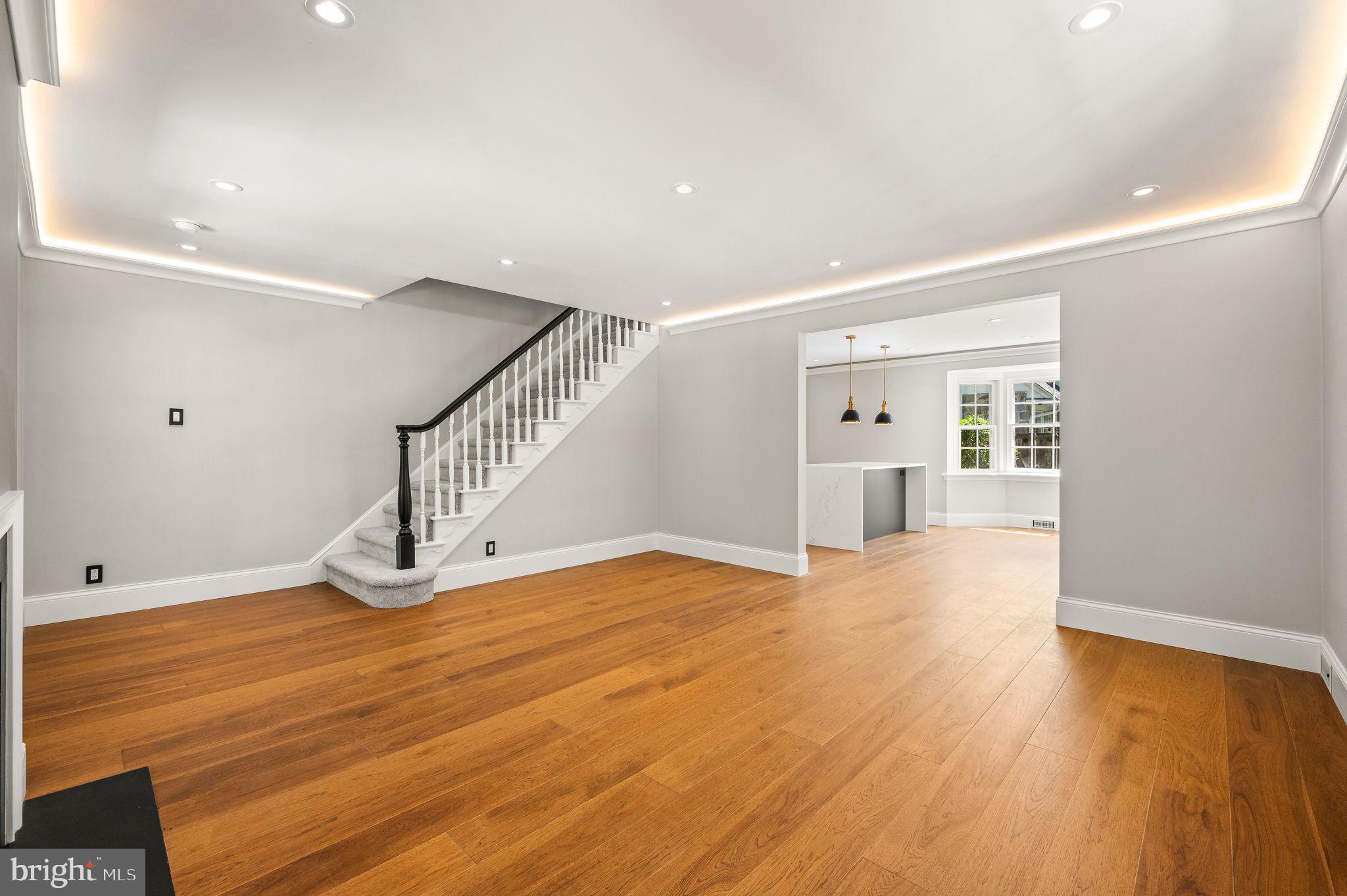 547 West Beechtree Lane Wayne, PA 19087 - Photo 8 of 51 a view of an empty room with wooden floor and stairs