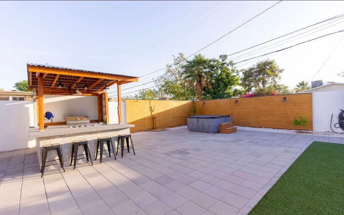 4214 North 20th Street Phoenix, AZ 85016 - Photo 32 of 40 a backyard of a house with table and chairs